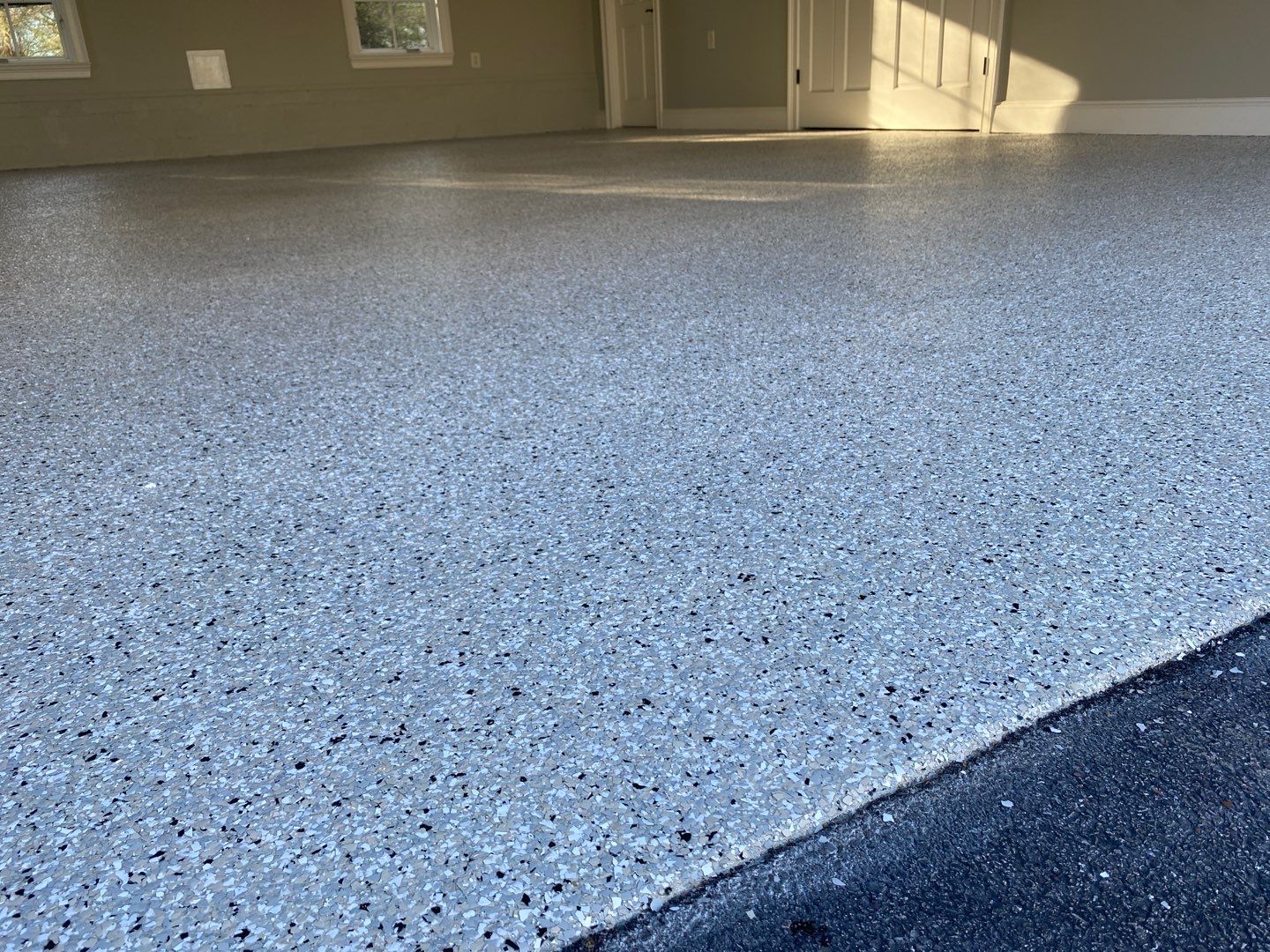 Concrete coating polyurea and flake on a garage floor